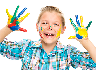 Image showing Portrait of a cute girl playing with paints