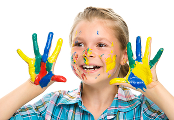 Image showing Portrait of a cute girl playing with paints