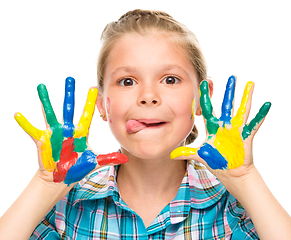 Image showing Portrait of a cute girl playing with paints