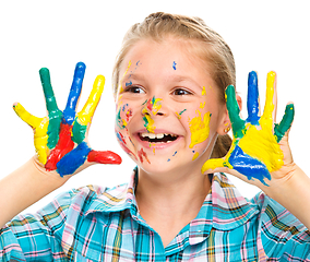 Image showing Portrait of a cute girl playing with paints