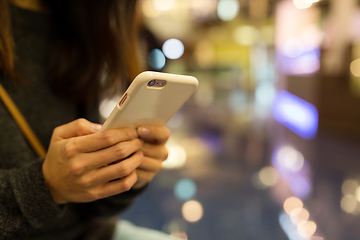 Image showing Woman holding mobile phone