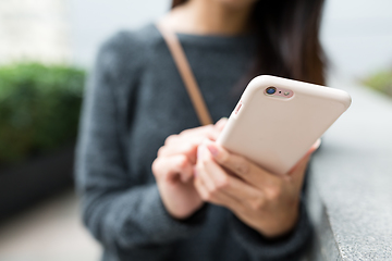 Image showing Woman working on mobile phone