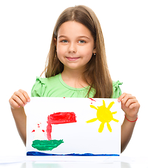 Image showing Little girl is showing her painting