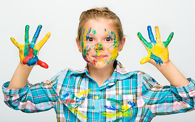 Image showing Portrait of a cute girl playing with paints