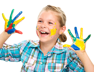 Image showing Portrait of a cute girl playing with paints