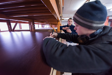 Image showing carpenter writing a receipt