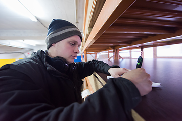 Image showing carpenter writing a receipt