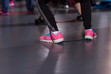 Image showing sporty women exercising with a rubber bands