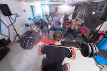 Image showing sporty women using barbells while exercises