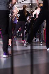 Image showing sporty women exercising with a rubber bands