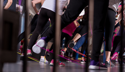 Image showing sporty women exercising with a rubber bands