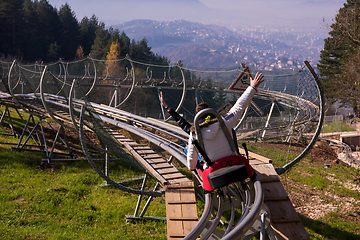 Image showing couple driving on alpine coaster