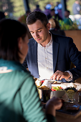 Image showing youn couple enjoying lunch at restaurant