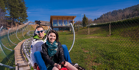 Image showing couple driving on alpine coaster