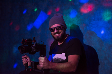 Image showing videographer in neon disco party