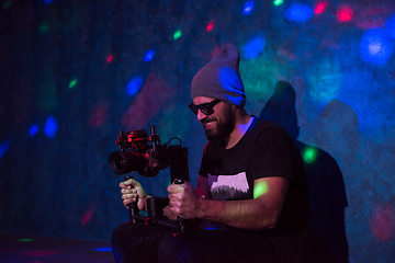 Image showing videographer in neon disco party