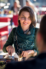 Image showing youn couple enjoying lunch at restaurant