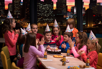 Image showing happy young boy having birthday party