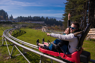 Image showing couple driving on alpine coaster