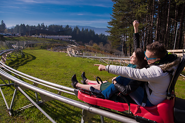 Image showing couple driving on alpine coaster