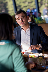 Image showing youn couple enjoying lunch at restaurant