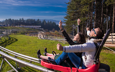 Image showing couple driving on alpine coaster