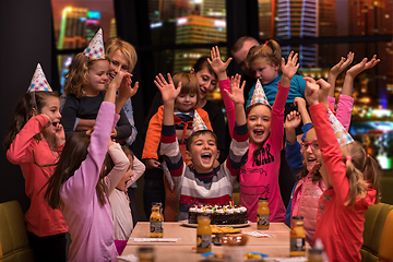 Image showing happy young boy having birthday party