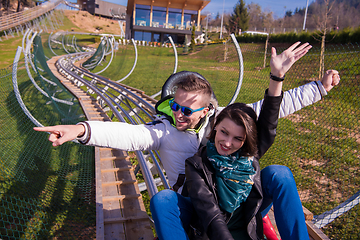 Image showing couple driving on alpine coaster