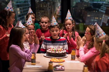 Image showing happy young boy having birthday party