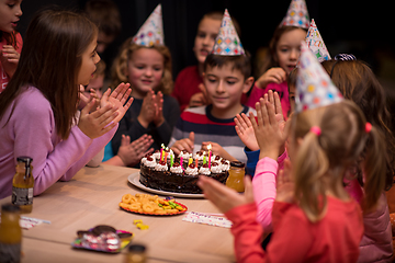 Image showing The young boy joyfully celebrating his birthday