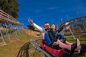 Image showing couple driving on alpine coaster