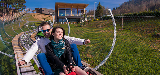 Image showing couple driving on alpine coaster