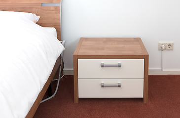 Image showing Bed and bedside table