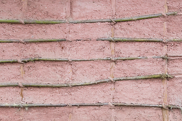 Image showing Bamboo texture in poured concrete wall