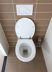 Image showing White toilet bowl in the bathroom