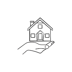 Image showing Hand holding house hand drawn outline doodle icon.