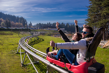 Image showing couple driving on alpine coaster