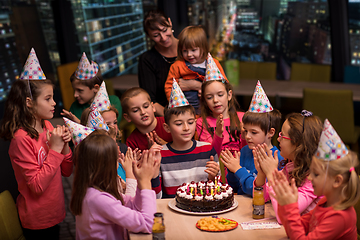 Image showing happy young boy having birthday party