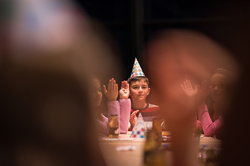 Image showing The young boy joyfully celebrating his birthday