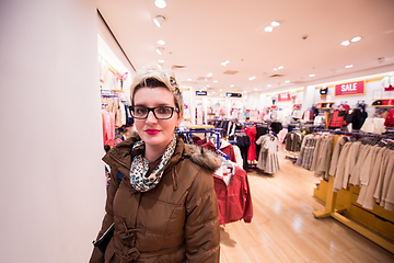 Image showing portrait of young woman in clothing store