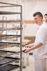 Image showing bakers preparing the dough