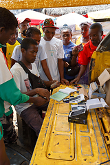 Image showing Man sell cellular phones on rural Madagascar marketplace