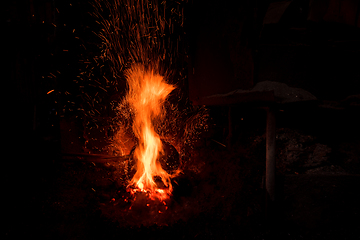 Image showing Traditional blacksmith furnace with burning fire