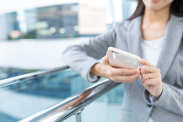 Image showing Businesswoman working on cellphone