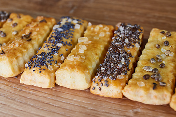 Image showing baked sticks with caraway, poppy, chia seeds, salt