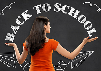 Image showing Half-length close up portrait of young woman, back to school