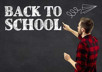 Image showing Half-length close up portrait of young man, back to school