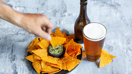 Image showing Glass of light beer on white stone background