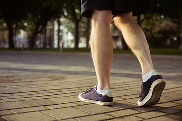 Image showing Senior man as runner with armband or fitness tracker at the city\'s street