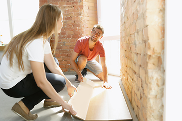 Image showing Young couple doing apartment repair together themselves